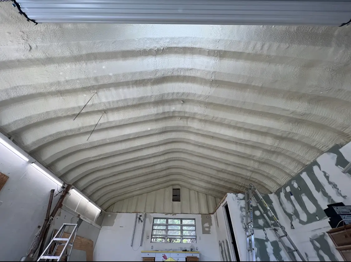 Spray polyurethane foam applied to the underside of a metal roof deck in Blendon